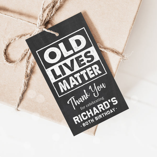 Editable birthday party tags for him. These 'Old Lives Matter' theme Thank You tags are perfect for party favor gifts, and as part of a man's birthday party decorations. Chalk white on a classic chalkboard background. By Tangled Tulip Designs.