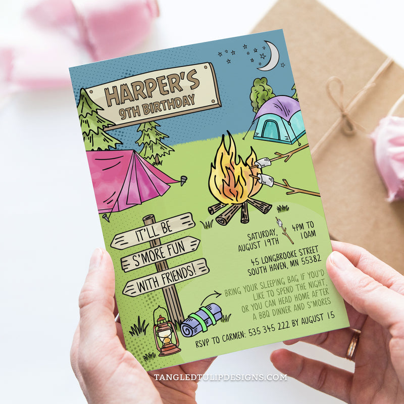 An editable S'mores Campout birthday invitation featuring a big campfire and roasting marshmallows for S'mores, with tents for camping in the background.