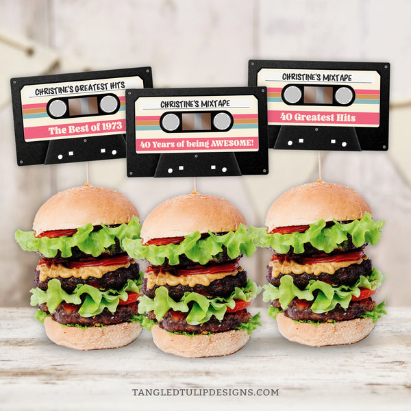 These Cassette Tape Cupcake Toppers are perfect for adding a touch of vintage flair to your mixtape party decorations for a 40th birthday, or any age. Whether adorning cupcakes or used as slider toppers, these are sure to be a hit. Tangled Tulip Designs - Birthday Invitations