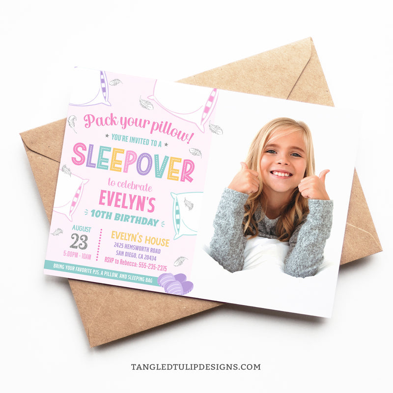 An editable Sleepover party invitation featuring a photo of the birthday girl. Ready for a fun-filled pillow fight, this invite is adorned with fluffy pillows and delicate feathers floating around. Pack Your Pillow, girls... it's a slumber party! Tangled Tulip Designs - Birthday Invitations