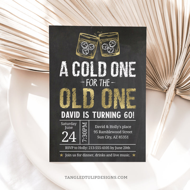 Editable Cold One for the Old One birthday invitation in a Whiskey theme. Featuring elegant gold and white on a classic chalkboard effect background, with whiskey glasses. Suitable for any milestone birthday. Instant Download and Editable in Corjl. By Tangled Tulip Designs.