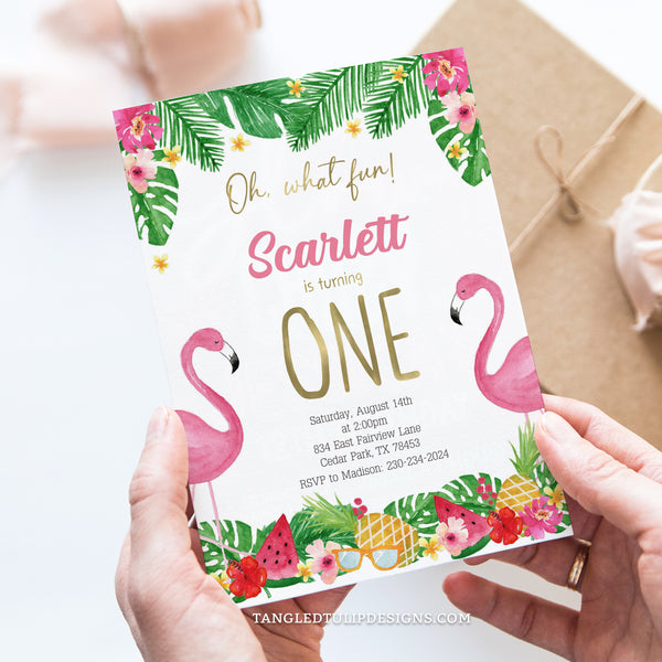 Flamingo first birthday invitation in a tropical theme, with pink flamingos and tropical fruits, flowers and leaves. Oh, What Fun it is turning One! Tangled Tulip Designs - Birthday Invitations