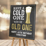 Whether it's a 40th birthday or any age milestone, this customizable welcome sign sets the perfect tone for a beer-themed party! Featuring a classic chalkboard background with elegant gold accents, it's time to have a Cold One with the Old One and raise a glass to the guest of honor! Instant Download and Editable in Corjl. By Tangled Tulip Designs.