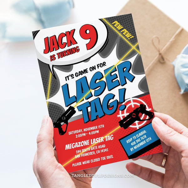A Laser Tag birthday invitation for boys. Featuring laser tag guns with bright lasers shooting targets in blue and red. Invitation template to edit in Corjl. By Tangled Tulip Designs.