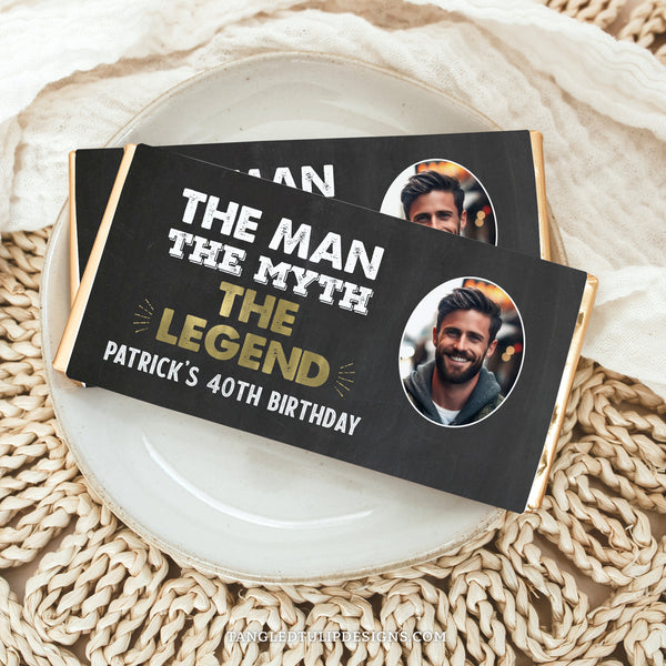 "The Man, The Myth, The Legend" Birthday Hershey Bar wrapper template, designed to add a touch of elegance to any man's birthday celebration! This template features a gold and white color scheme against a chalkboard effect background, creating a stylish and memorable look. With space to include your own photo, this wrapper template is perfect for personalizing birthday party favors and decorations.