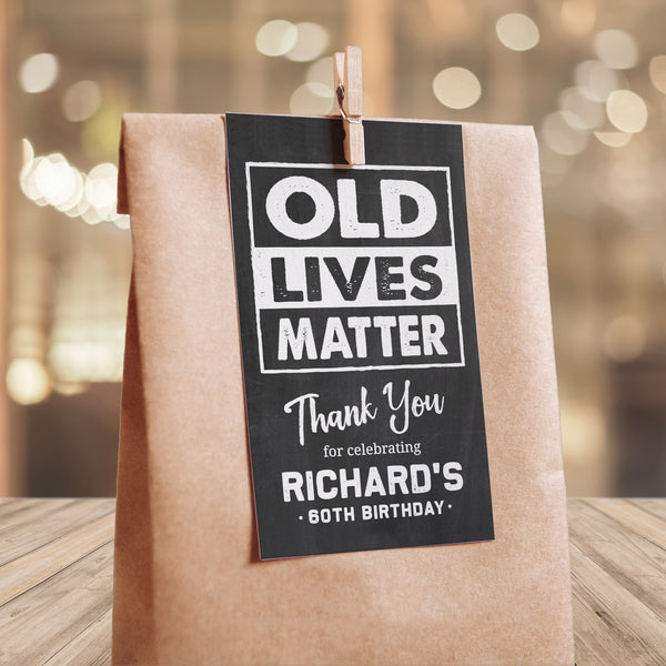 Editable birthday party tags for him. These 'Old Lives Matter' theme Thank You tags are perfect for party favor gifts, and as part of a man's birthday party decorations. Chalk white on a classic chalkboard background. By Tangled Tulip Designs.