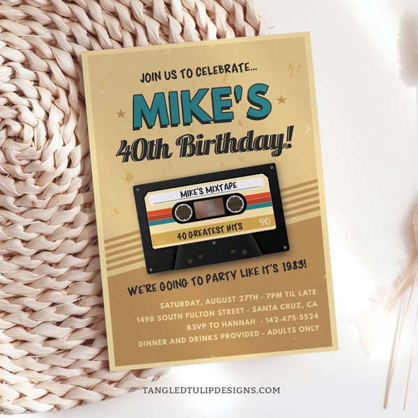 Get ready to rewind the clock and groove with this Mixtape Birthday Invitation! The retro design features a classic cassette tape filled with Greatest Hits, setting the stage for a birthday bash that's sure to hit all the right notes. Tangled Tulip Designs - Birthday Invitations