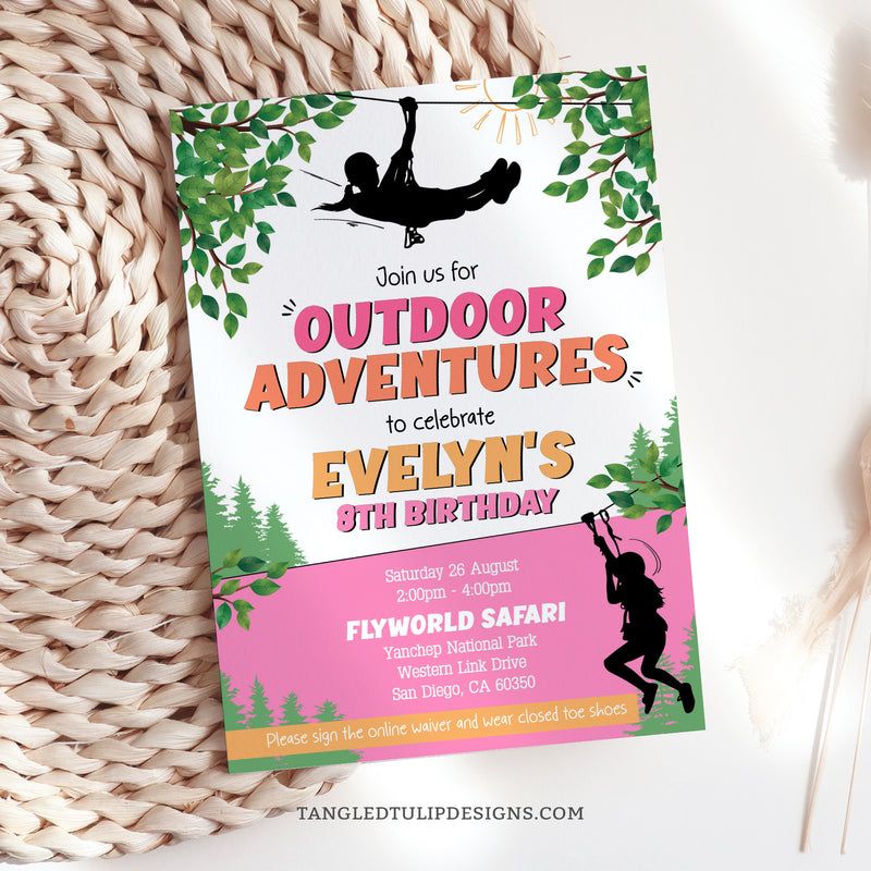 This editable birthday party invitation in a vibrant design, features girls ziplining through the trees, promising an unforgettable zipline birthday party. Tangled Tulip Designs - Birthday Invitations