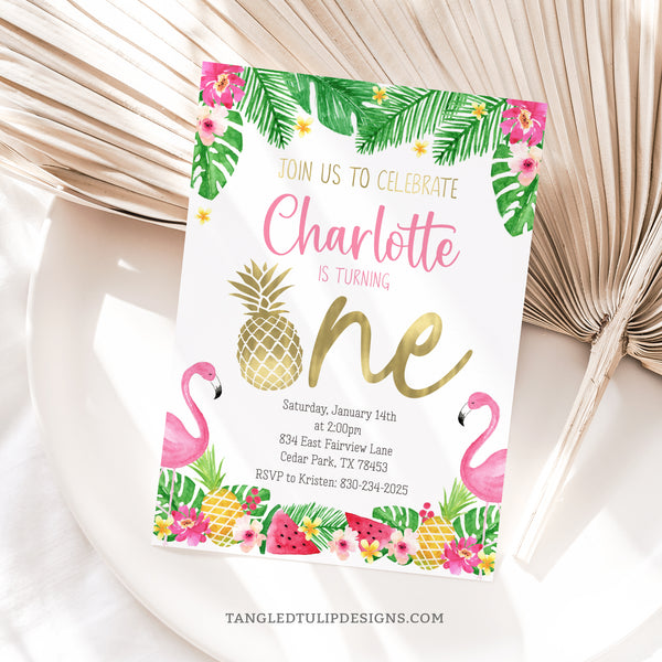 This editable Pineapple First Birthday Invitation is perfect for your little girl's tropical celebration, featuring charming watercolor flamingos, pineapples, watermelon, and tropical flowers, all accented with pretty gold touches. Tangled Tulip Designs - Birthday Invitations