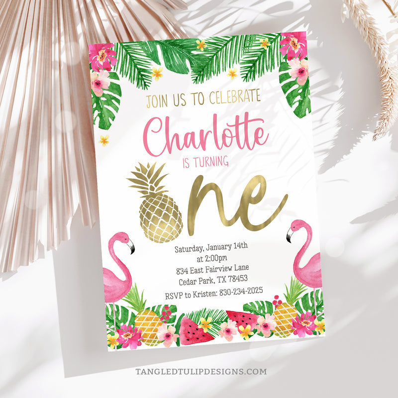 This editable Pineapple First Birthday Invitation is perfect for your little girl's tropical celebration, featuring charming watercolor flamingos, pineapples, watermelon, and tropical flowers, all accented with pretty gold touches. Tangled Tulip Designs - Birthday Invitations