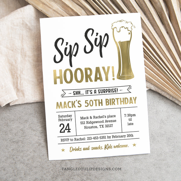 A Surprise Birthday invitation for a man in a beer theme. Sip Sip Hooray for his milestone birthday. This classic gold and white invitation, adorned with a shimmering beer, sets the perfect tone for a memorable beer-themed surprise party! Tangled Tulip Designs - Birthday Invitations