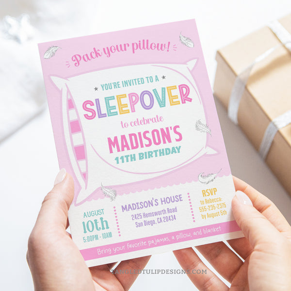 A Sleepover party invitation for girls. Get ready for a fun-filled sleepover party with this design featuring a big fluffy pillow and delicate feathers floating around. Pack Your Pillow, girls! Tangled Tulip Designs