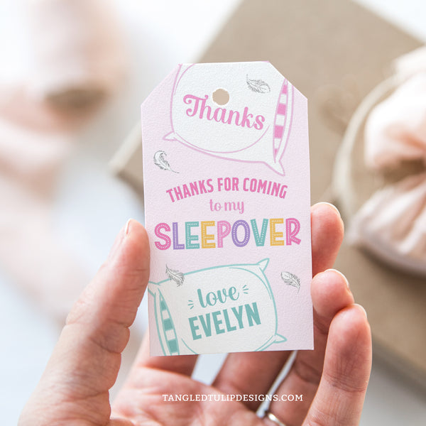 Thank your guests with these pretty Sleepover Party tags, featuring big fluffy pillows and delicate feathers floating around on a soft pink background. Instant Download and Editable in Corjl. By Tangled Tulip Designs.