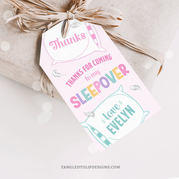 Thank your guests with these pretty Sleepover Party tags, featuring big fluffy pillows and delicate feathers floating around on a soft pink background. Instant Download and Editable in Corjl. By Tangled Tulip Designs.