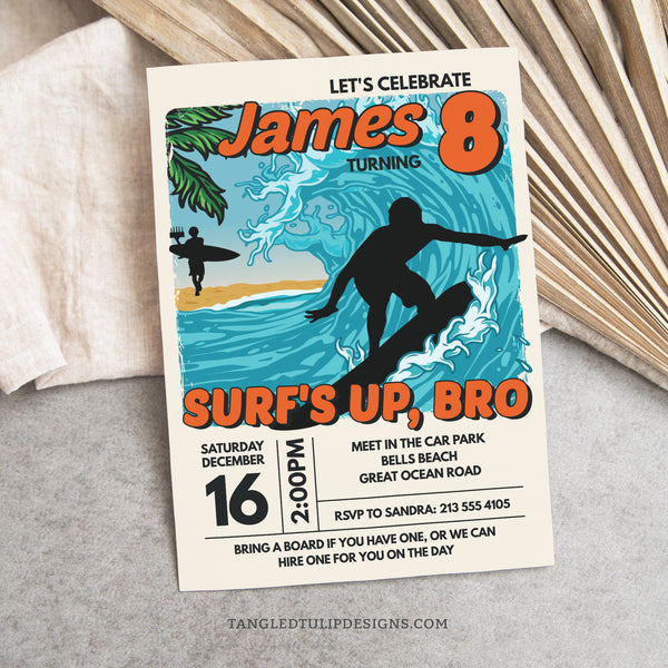 A surfing birthday invitation with a vintage look. Featuring a surfer catching a huge wave, and another walking down the beach with the birthday cake. Surf's Up, Bro. Tangled Tulip Designs - Birthday Invitations