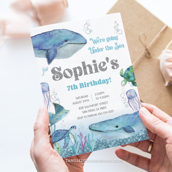Whales Birthday invitation, featuring an enchanting Under the Sea theme! With watercolor whales and delightful sea creatures like turtles and jellyfish, all adorned with pretty glitter silver accents. Instant Download and Editable in Corjl. By Tangled Tulip Designs.
