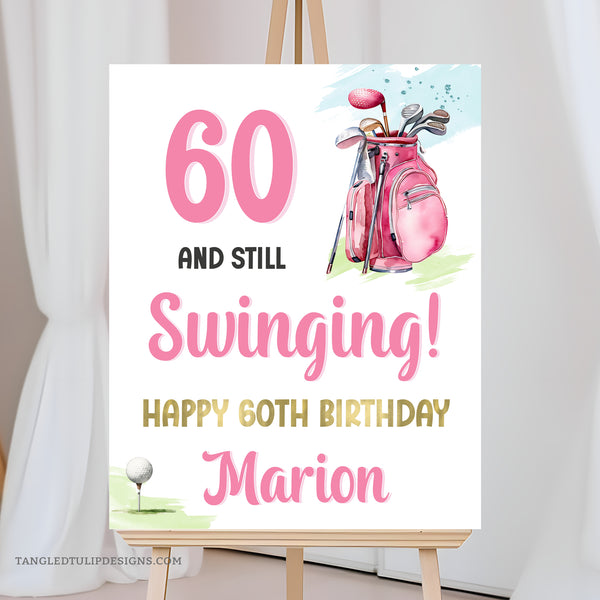 A woman Golfer 60th Birthday sign with a golf bag and golf ball on a tee. 60 and Still Swinging! Happy 60th Birthday editable sign template. Pink and Gold.