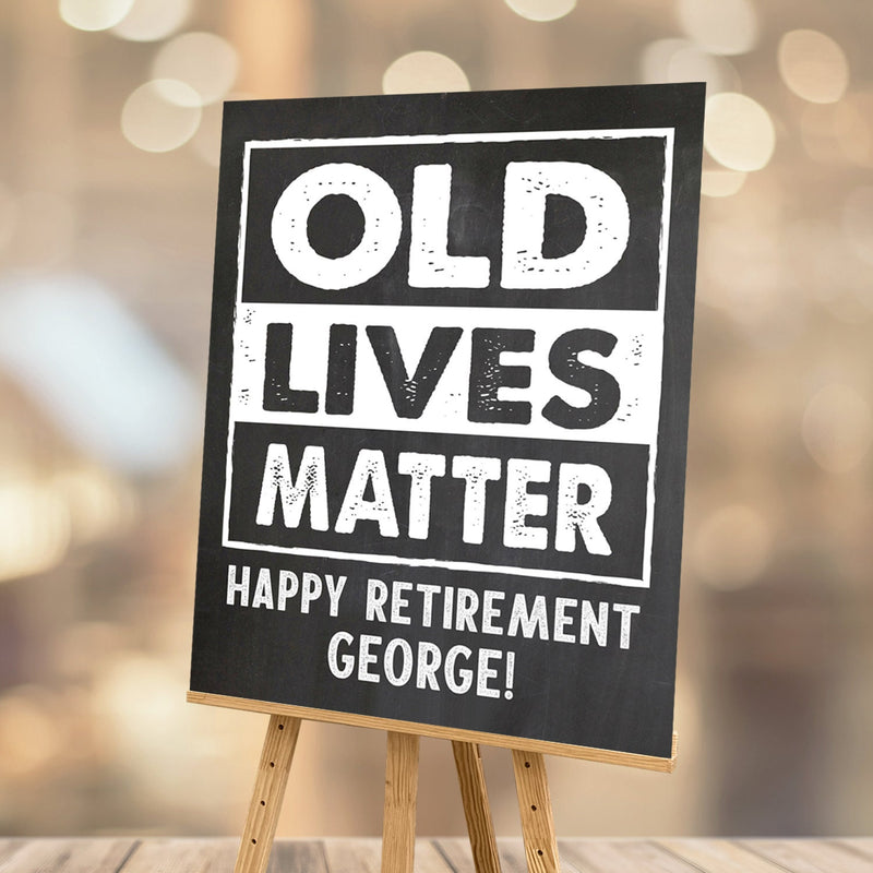 'Old Lives Matter' Retirement Party Sign in chalk white on a charming chalkboard effect background. Add the guest of honor's name to add a personal touch to their retirement party decorations.