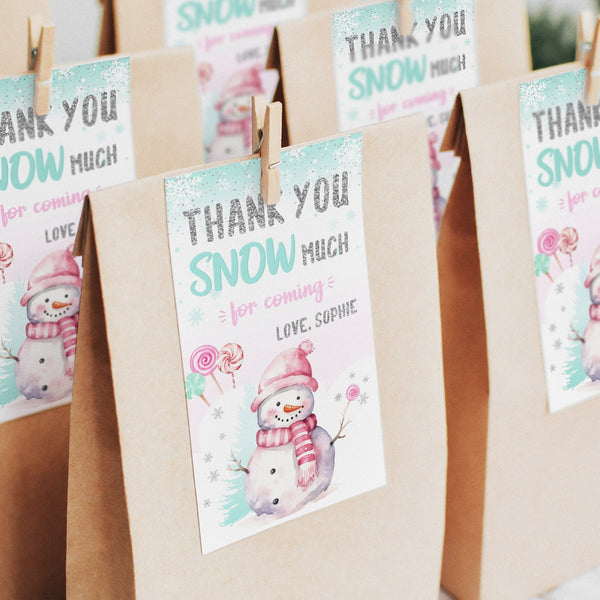 Thank your guests with our adorable Winter Snowman Birthday Thank You Tags!  Featuring a charming snowman and lollipops nestled in the snow, these editable tags are perfect for adding a touch of pink and silver sparkle to your birthday party favors.